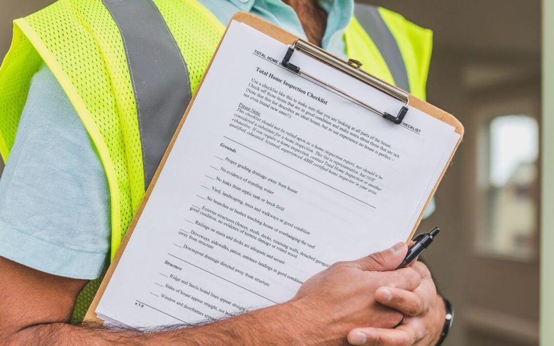 Technician completing a garage door maintenance checklist